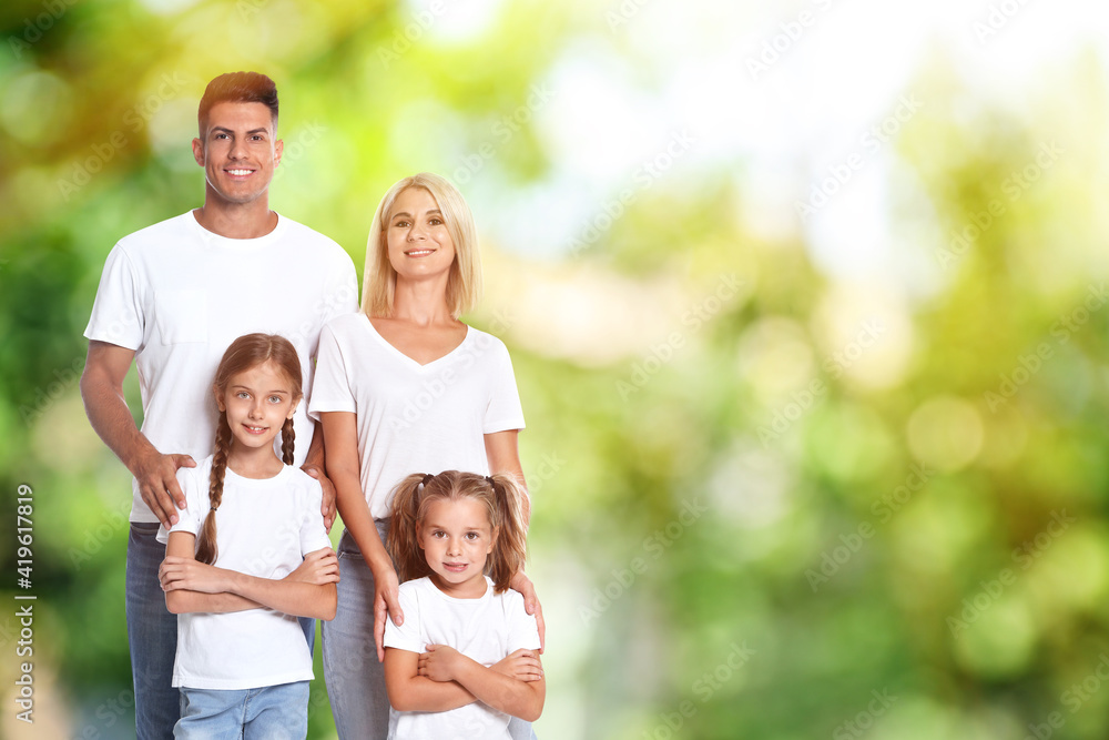 Happy family with children outdoors on sunny day, space for text Happy family with children outdoors on sunny day, space for text