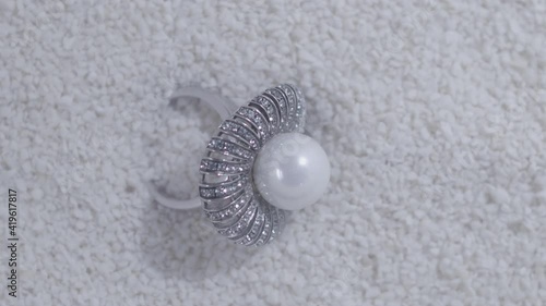 Beautiful and shiny ring with pearl underwater.