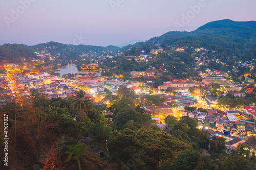 Cityscape view from Bahirawakanda at night of Kandy city lights, Kandy Lake and hill country in Sri Lanka.