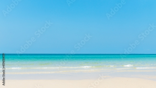 Vacations and summerTrip. Beautiful white sand beach for tours travel in the holiday. The shadow of a tree leading to the sea Summer nature view. Background and abstract