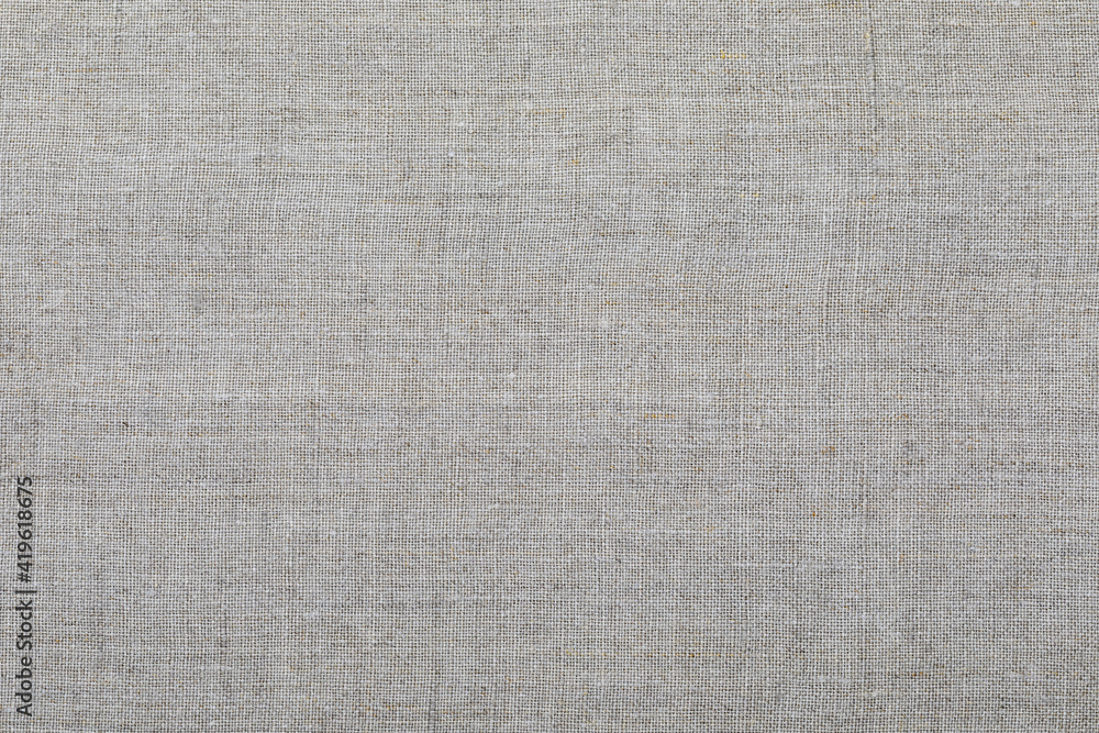 Fototapeta premium Delicate linen fabric texture. Macro close-up. With space for your texts.