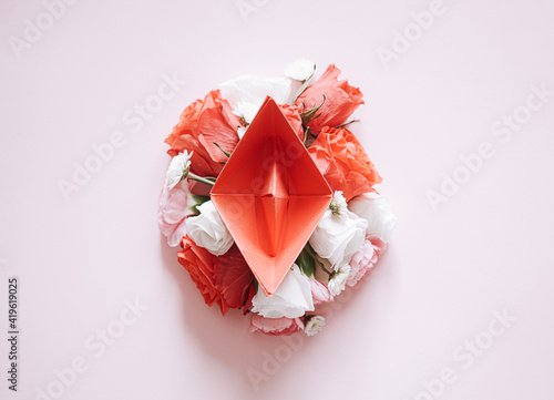 Obraz na płótnie women Health. red paper boat on flower buds. abstract symbolic image of the female reproductive system w salonie
