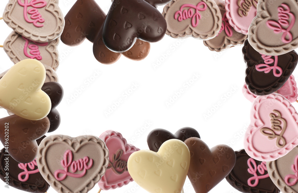 Obraz premium Frame made of heart shaped chocolate candies on white background