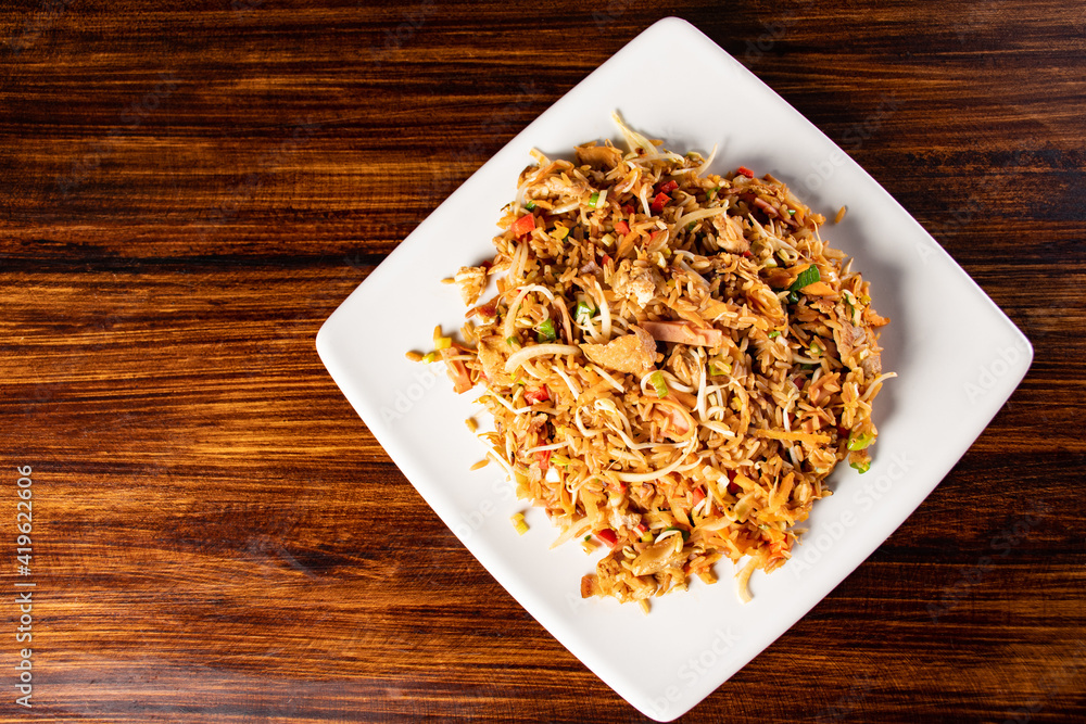 A plate of oriental food special fried rice