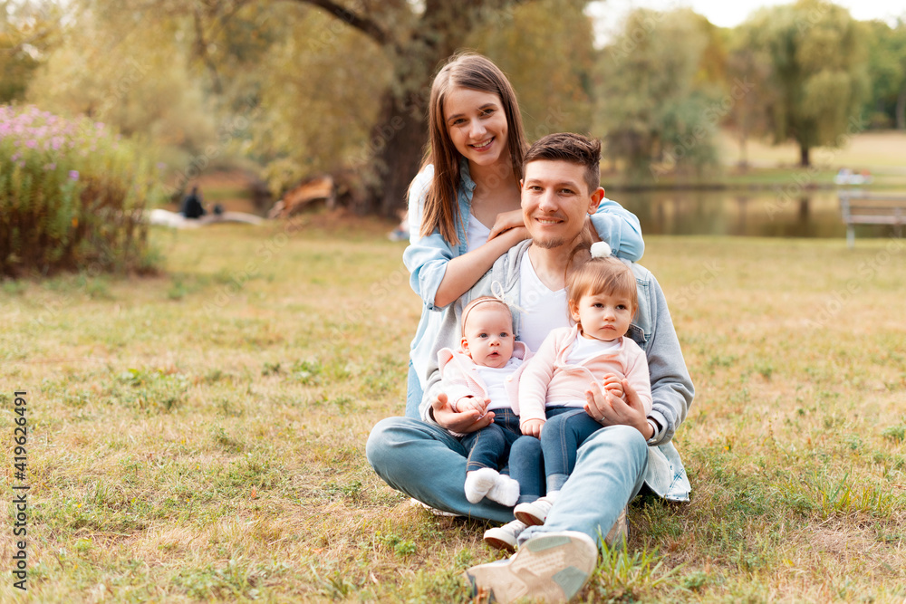 Portrait of a young beautiful family spending time together. Portrait of a young beautiful family spending time together.