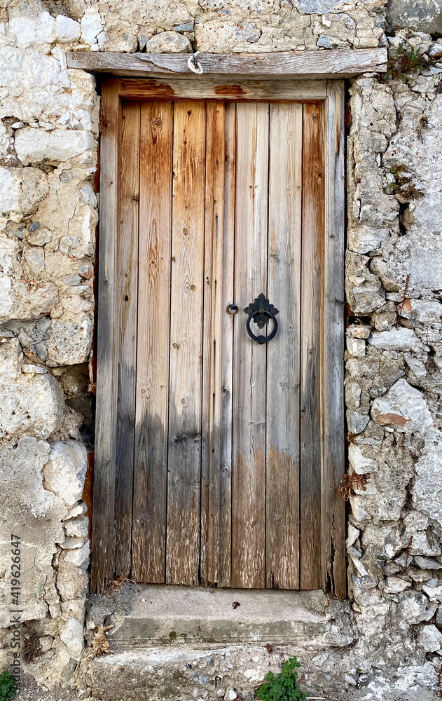 Old wooden door in Kritsa town,