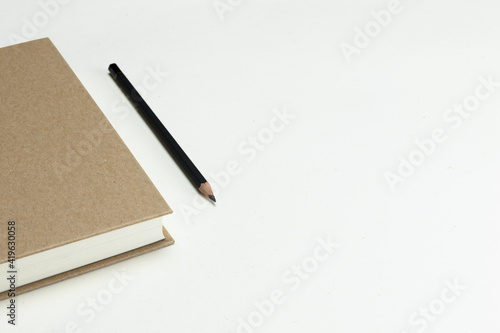 Notebook with a hardcover brown on a light background, a place to record