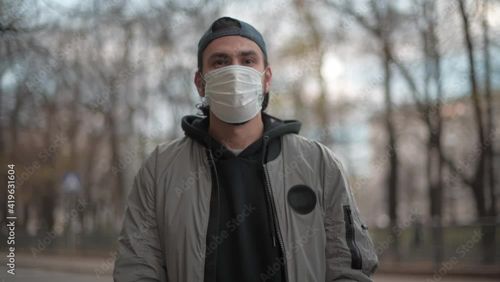 The man takes off his medical mask. The man takes off his medical mask.