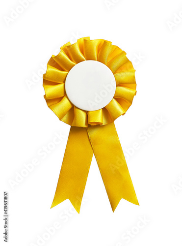Yellow rosette ribbon with a blank copy space, isolated on a white background.