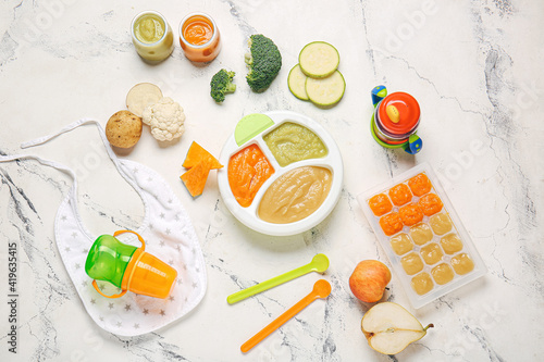 Composition with healthy baby food and ingredients on light background