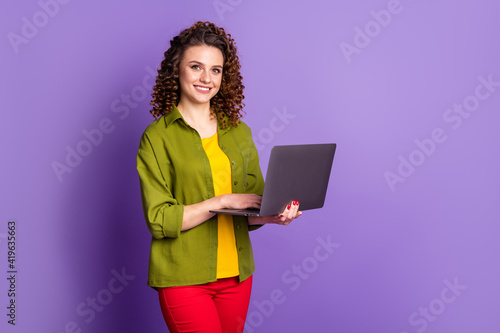 Photo of positive girl ceo expert use laptop texting typing wear style pants trousers isolated over purple color background