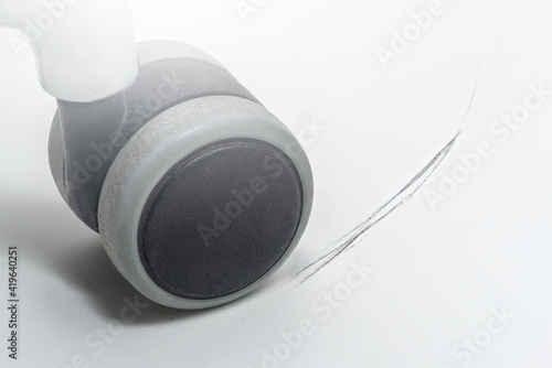 Scratch on the floor from the wheel of an office chair