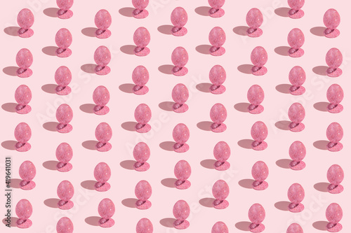 Wallpaper Mural Easter pattern made of pink glittering eggs on pastel background. Festive concept Torontodigital.ca