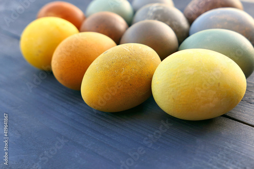 Easter eggs natural coloring on wooden background. Colorful Easter eggs collection.