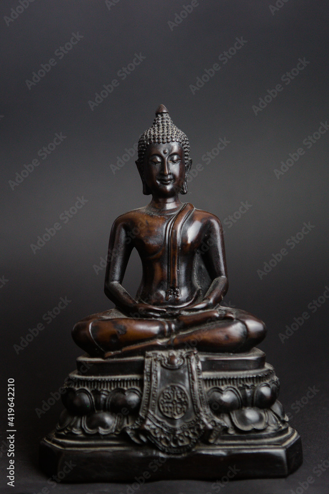 statue of wooden buddha, showing peace and serenity