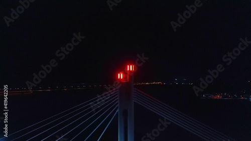 Aerial view of the light on the Jatkankynttila bridge,  evening, in Rovaniemi, Finland - tracking, drone shot photo