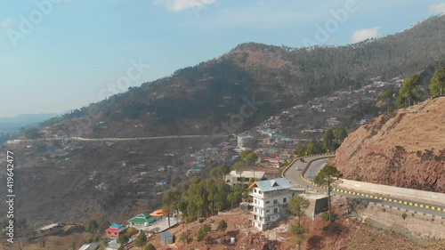 Aerial View Of Winding Road With Traffic Going Past In  Muzaffarabad In Pakistan photo