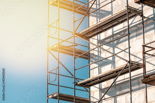 Scaffolding on multi storey building facade during facade renovation