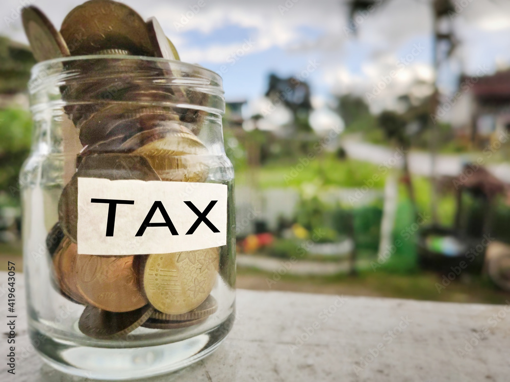 Obraz premium Tax-filling concept - Tax word on white surface background. Stock photo.