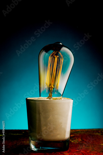 Wallpaper Mural Retro lamp with an Edison lamp on a blue background Torontodigital.ca