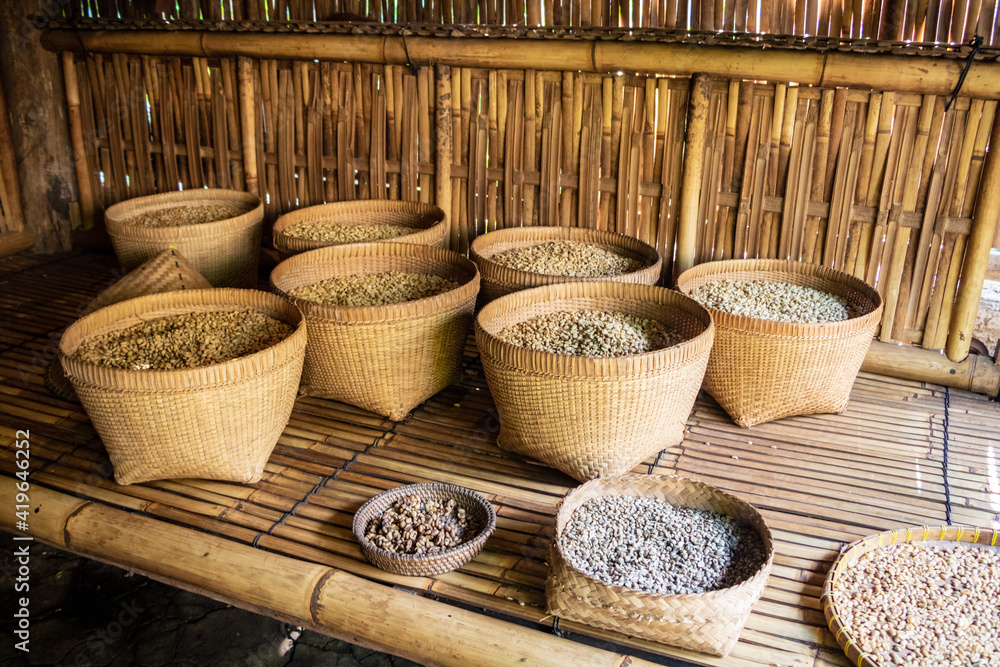 organic bags of a mature toasted a raw coffee beans put on a shelves at a warehouse organic bags of a mature toasted a raw coffee beans put on a shelves at a warehouse