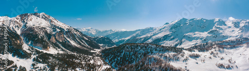 Panorama with lots of snow on Lukmanier in Ticino, on the Swiss Alps. Beautiful landscape, aerial point of view of mountains and valley