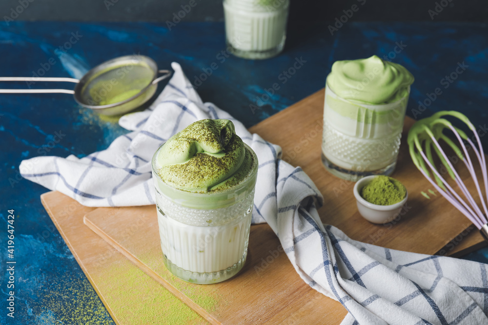 Composition with tasty dalgona matcha latte on table Composition with tasty dalgona matcha latte on table