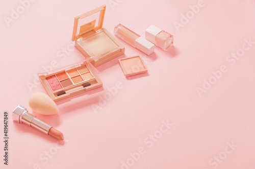 nude decorative cosmetics on pink background