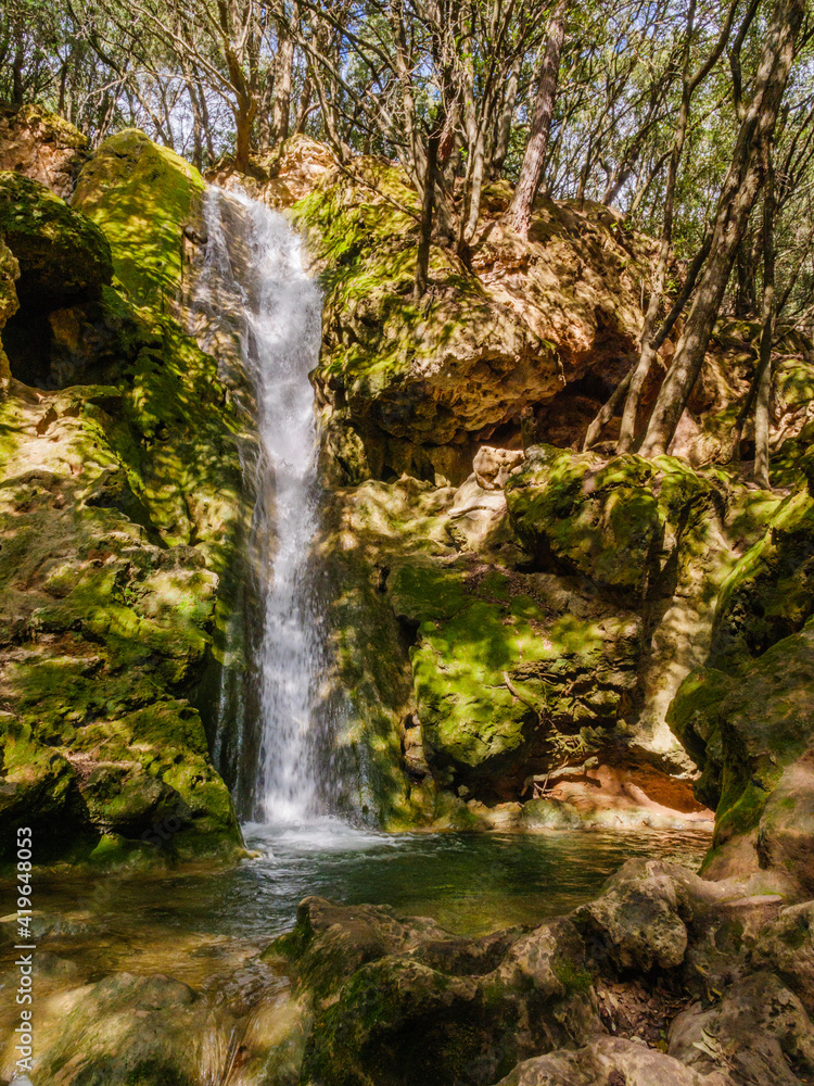 Fototapeta premium waterfall of Salt d'es Freu, a hiking area with waterfall near the village of Bunyola on the balearic island of mallorca, spain