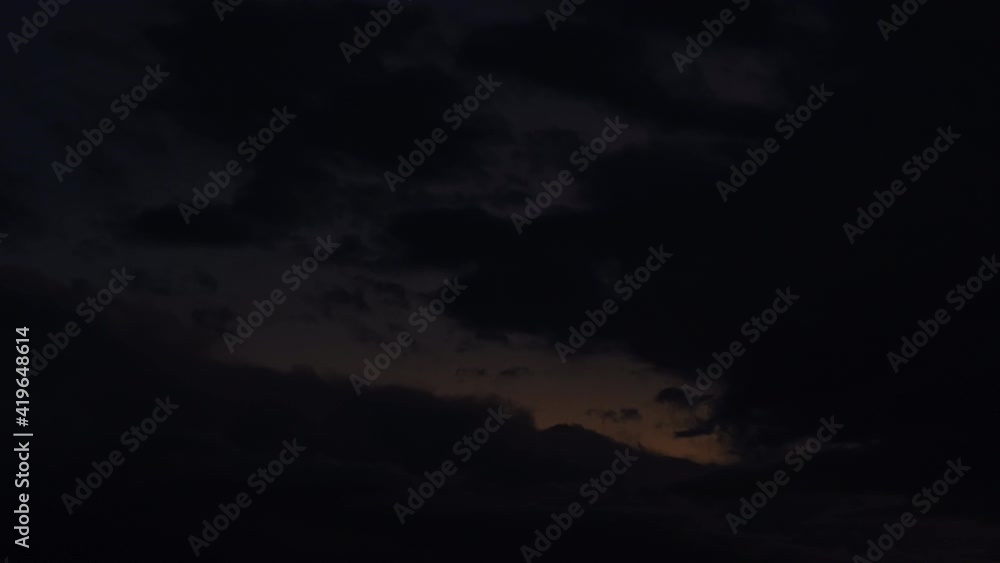 Moving moody clouds on sky during sunset, from evening to night, time lapse Moving moody clouds on sky during sunset, from evening to night, time lapse