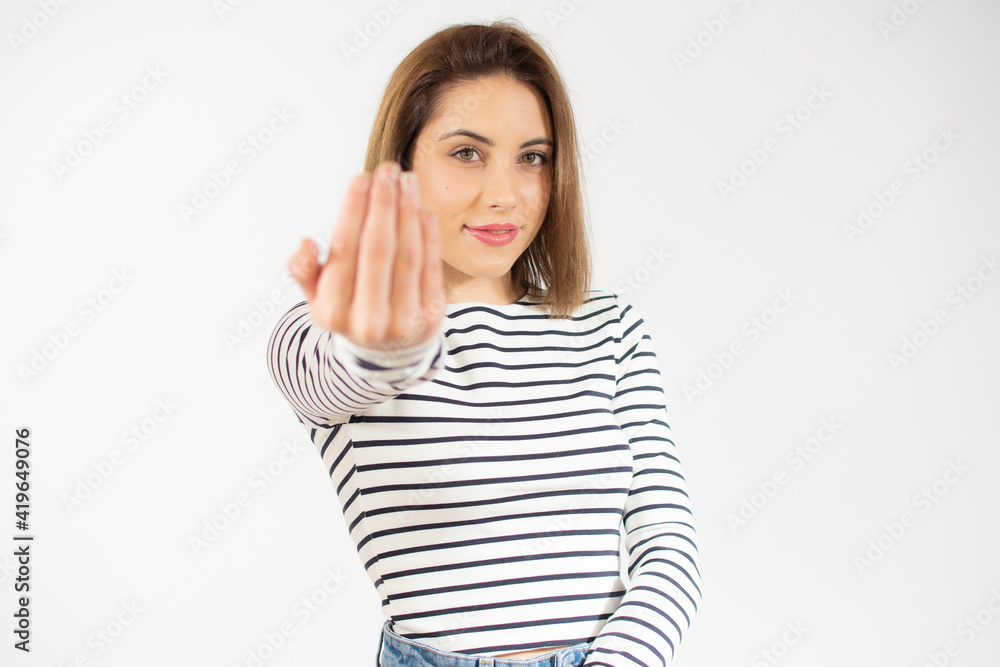 Young woman over isolated white background inviting to come with hand. Happy that you came Young woman over isolated white background inviting to come with hand. Happy that you came