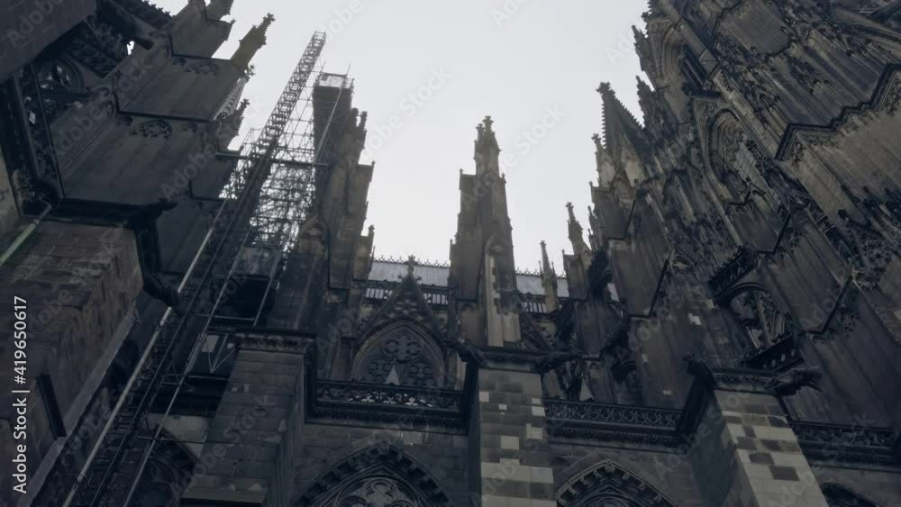 Cologne Cathedral in Germany Left Pan Shot in Winter with Scaffolding on a cloudy day. Cologne Cathedral in Germany Left Pan Shot in Winter with Scaffolding on a cloudy day.
