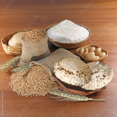 Rustic shot of a plate of chapati surrounded by ingredients