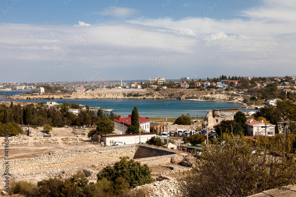 View of the ancient ruins of Chersonesos and the city of Sevastopol in the distance. Travel concept.