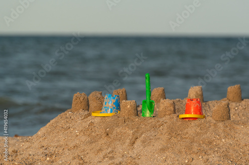 Sand castle on the beach. Fun for children at sea.