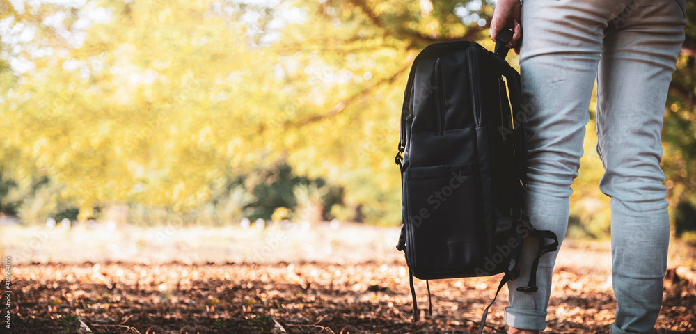 Tourist woman holding bag travel in the forest. Tourist woman holding bag travel in the forest.