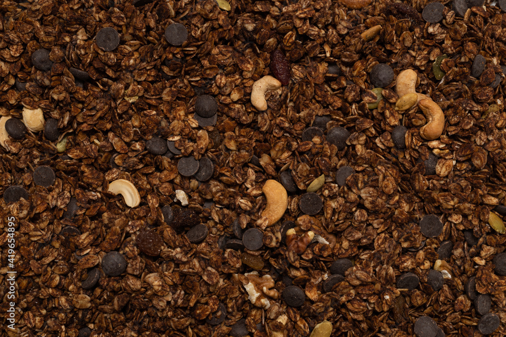 Chocolate granola cereal with nuts background. Chocolate granola cereal with nuts background.