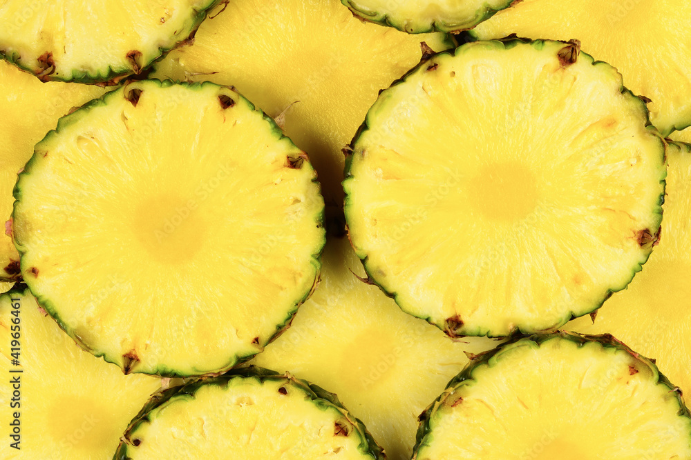 Pineapple juicy yellow slices background. Top view. Pineapple juicy yellow slices background. Top view.