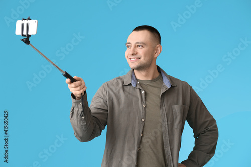 Handsome young man taking s...