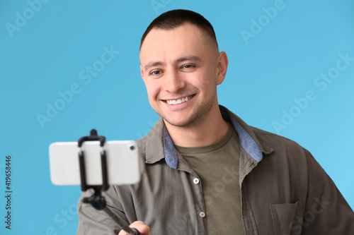 Handsome young man taking s...