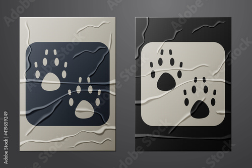 White Paw print icon isolated on crumpled paper background. Dog or cat paw print. Animal track. Paper art style. Vector.