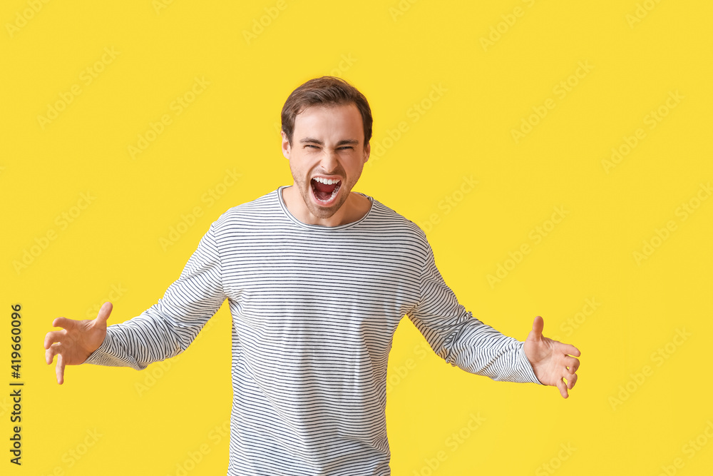 Emotional young man on color background Emotional young man on color background
