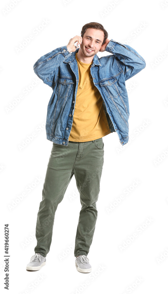 Handsome young man talking by mobile phone on white background Handsome young man talking by mobile phone on white background
