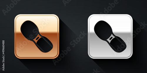 Gold and silver Human footprints shoes icon isolated on black background. Shoes sole. Long shadow style. Vector.