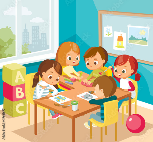 Little cute kids drawing and making arts and crafts, diy, sitting at the table. Art class lessons. Children's activities. Kids at the art classes.
