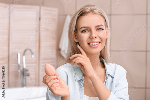 Beautiful young woman with ...