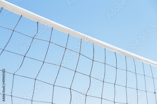 volleyball or tennis net on a background of blue sky © Taras