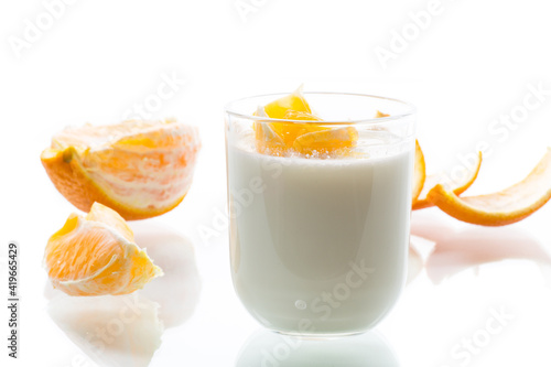 homemade sweet yogurt in a glass with oranges