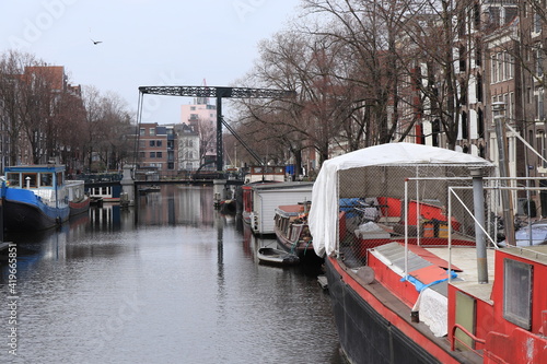 Amsterdam Brouwersgracht Canal with Boats and Historic Iron Bridge