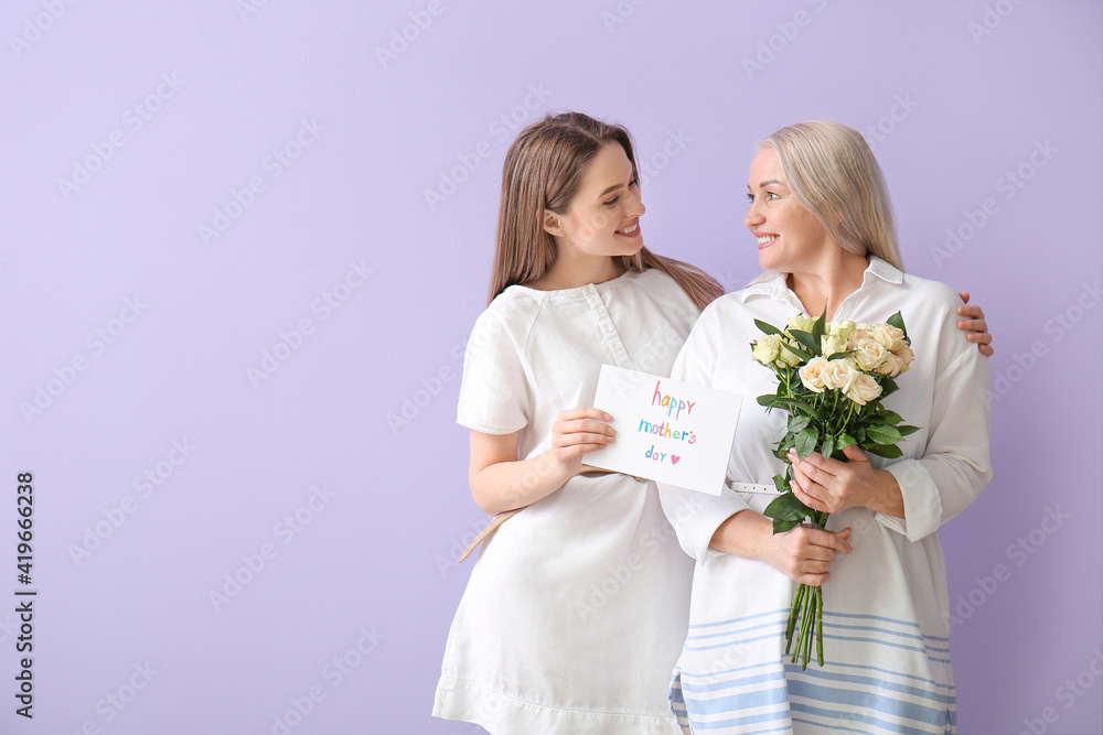 Young woman greeting her mom on Mother's Day against color background Young woman greeting her mom on Mother's Day against color background